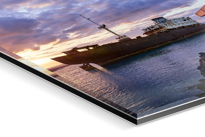 Abandoned shipwreck on calm sea at sunset with dramatic blue and orange clouds. - 45 x 30cm / Photo hinter Acrylglas / Unframed