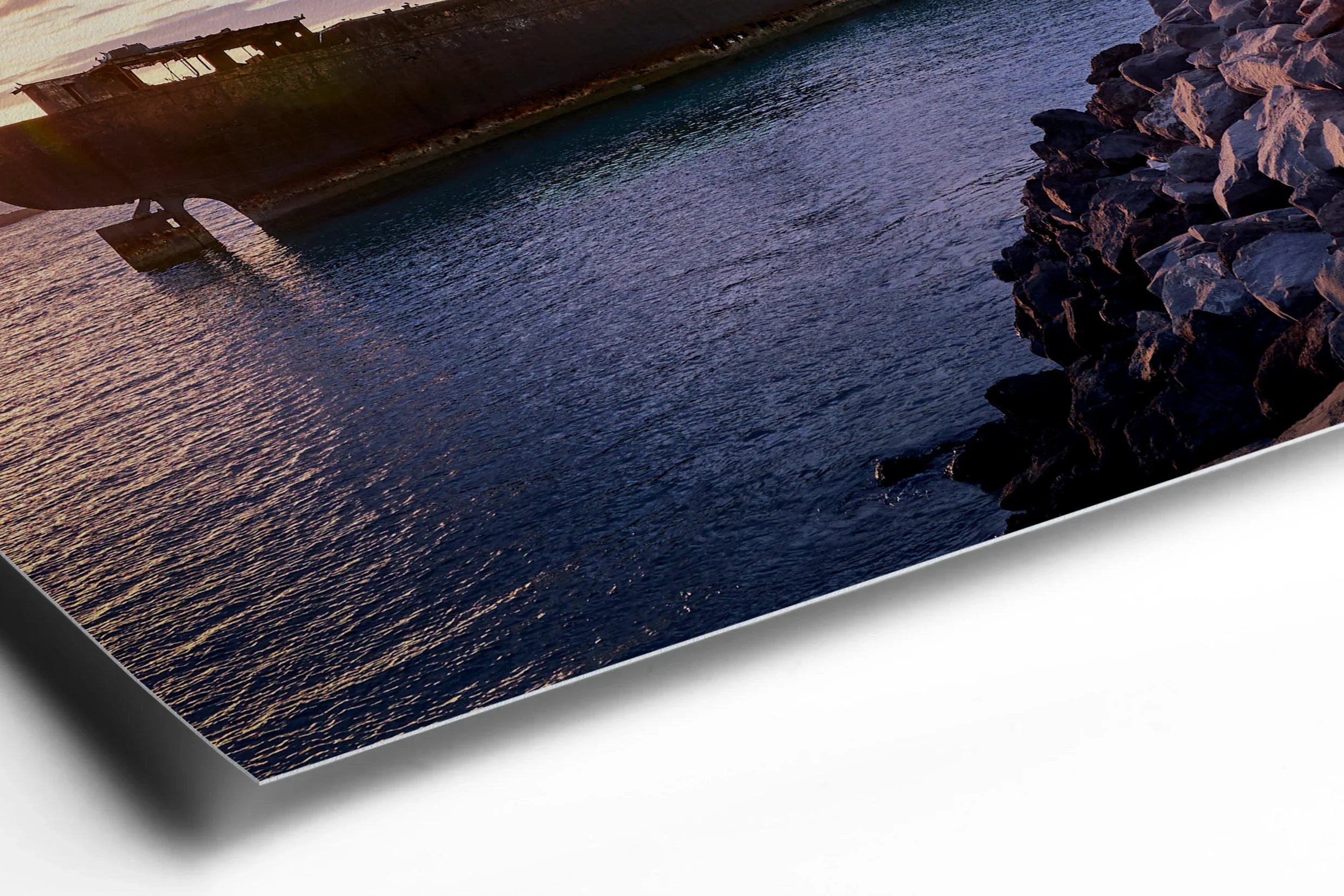 Abandoned shipwreck at dusk with deep blue water and rocky shoreline under cloudy sky. - 45 x 30cm / Photo hinter Acrylglas / Unframed