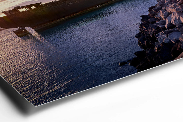 Abandoned shipwreck at dusk with deep blue water and rocky shoreline under cloudy sky. - 45 x 30cm / Photo hinter Acrylglas / Unframed