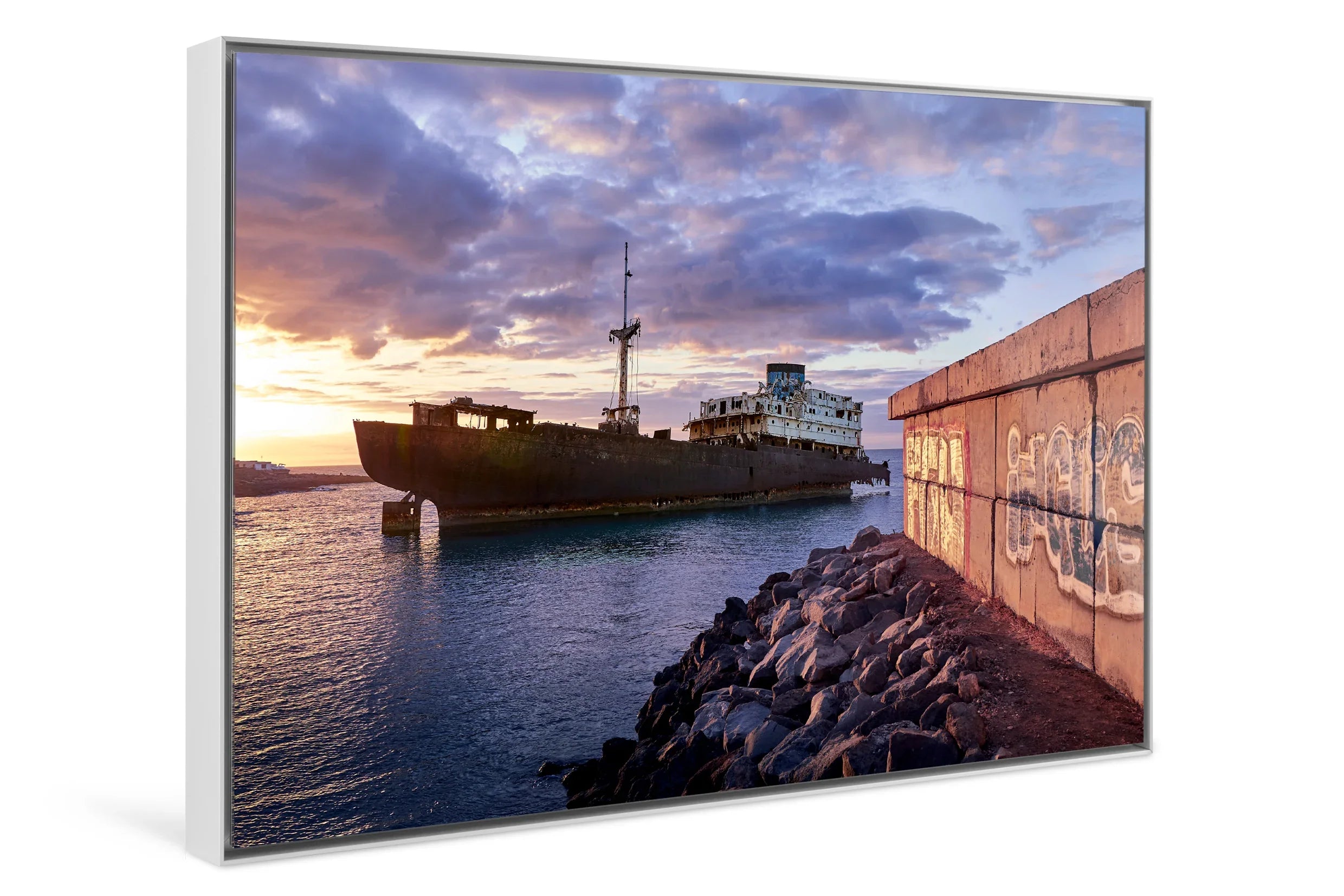 Rusty shipwreck at rocky shore under dramatic blue hour sky with clouds and wall graffiti. - 45 x 30cm / Photo hinter Acrylglas / Unframed
