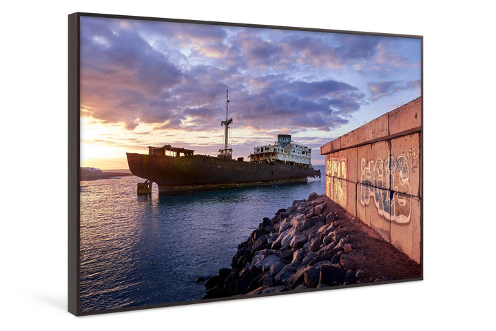Rusty abandoned ship near rocky shore under vibrant blue hour sky with dramatic clouds. - 45 x 30cm / Photo hinter Acrylglas / Unframed