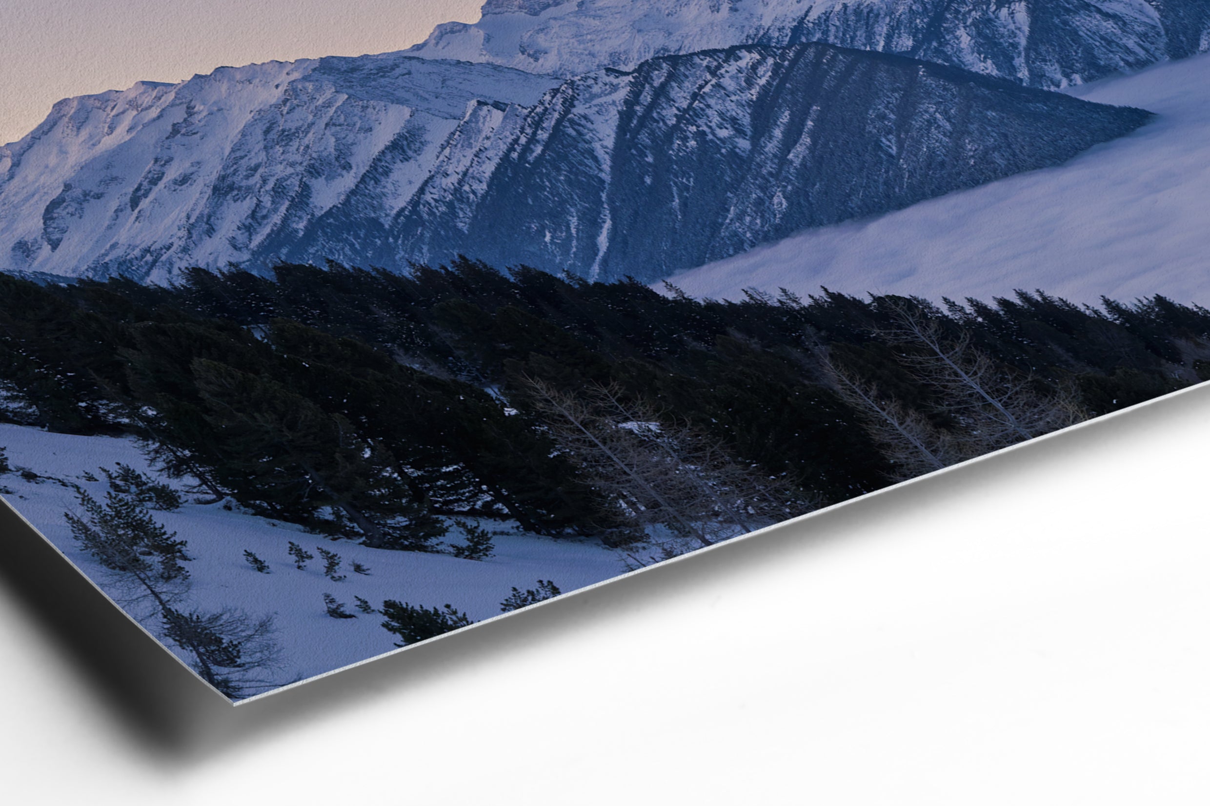 Snow-covered mountain peaks and pine trees under a deep blue twilight sky panorama print mounted behind acrylic glass. - 90 x 38 cm / Photo hinter Acrylglas / Unframed